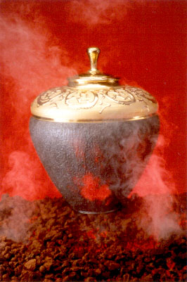 Multiple fired stoneware vessel with porcelain slip texture, and 23k gold fused to clay and glaze surface. 19"x 26" 2000.  Photo by Tom Holt.